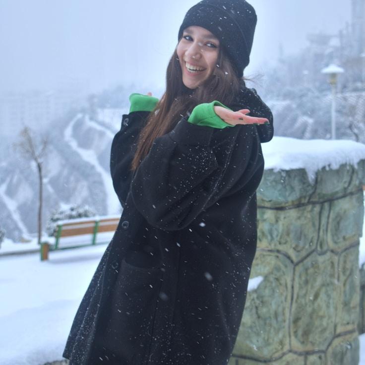 Aanya Singh, Lead Design Curator at Quiet Studio Harbor, reviewing corporate floral arrangements